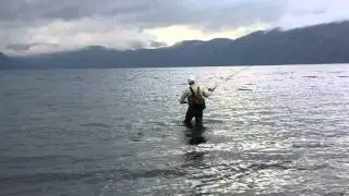 Fly casting Steelhead on trophy trout lake Bear Mountain
