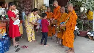 Pisoth and Pishnu give food and something for monk