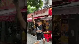 Chinese waiter balances food while dancing