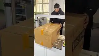 Large cardboard boxes can be easily packed with this automatic strapping machine