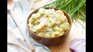 Austrian potato salad. Recipe for a delicious warm potato salad with chives and sauce.