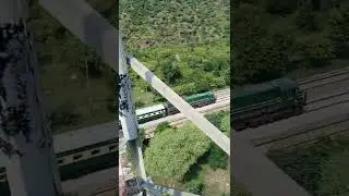 Amazing view of train passing through from green mountains of Tarki near Sohawa Pakistan Railways