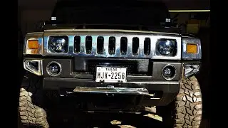 Hummer H2 headlight adjustment screw location