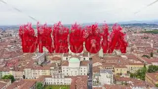 Inscription on video. Brescia, Italy. Cathedral of Santa Maria Assunta. Flight over the city in clou