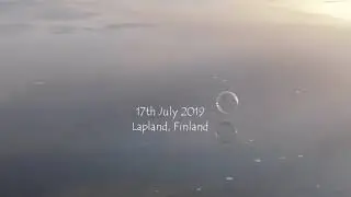 Bubbles bouncing on the calm surface of a lake