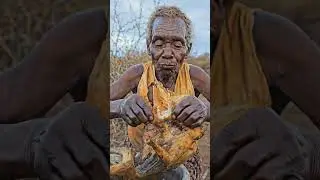 Hadzabe eating soft boiled meat cooked in forest style.#Hadzabe #PrimitiveCooking #SurvivalSkills