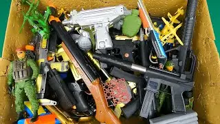 Box Full of Dozens of Realistic Toy Guns And Guns, Capsule Explosives And Beads Shooting Pistols