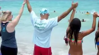 Tim Canova Joins Hands To Celebrate Water