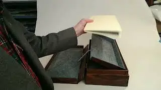 Walnut pop-up display box. Patent No. 11,166,552.