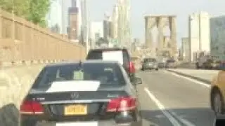 Uber drivers cross Brooklyn Bridge to protest IPO