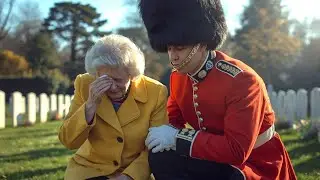 Royal Guard Tears Up as Woman Shares a Heart-Touching Moment in Front of a Soldier's Grave.