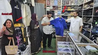 husband and his first wife go shopping in the city in the absence of their second wife.