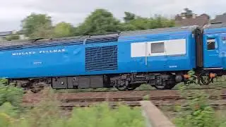 Bluepullman heading to Norwich passing Exeter Riverside yard