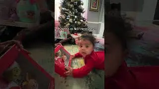 5 month old baby opens her first Christmas gift 😍