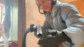Vacuuming the down jacket with Henry, leather gloves