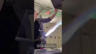 Blowing a glass bird