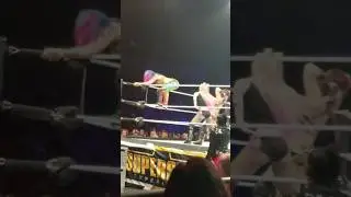 Asuka toys with Iyo Sky at WWE House Show