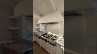 Ocean View Dream Kitchen with Custom Hood & Built-In Fridge/Freezer