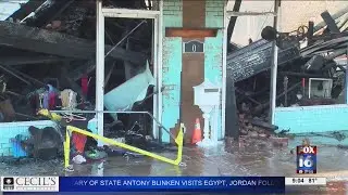 Fire rolling through buildings in downtown Atkins