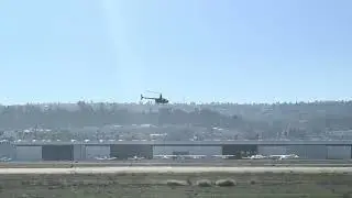 Robinson R66 helicopter taking off from Torrance airport 