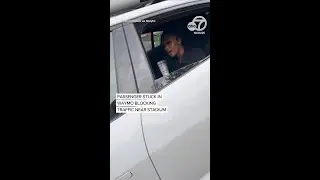 Passenger stuck in Waymo blocking traffic near stadium