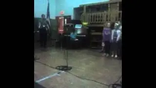 Nia plays piano at isbvi
