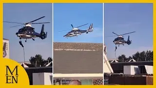 Moment masked figures ABSEIL from helicopter near Tesco in Manchester