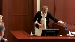 Amber Heard acts scared when being close to Johnny Depp