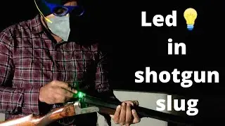 custom shotgun slug. led in 12 bore shotgun cartridge. electric tracer bullet.