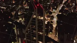 High angle view of modern design tall residential building and urban district in background. London