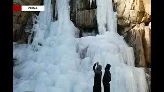 Stunning view of large icicle waterfall in East China's Mount Taishan