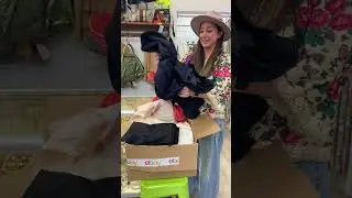 Unboxing vintage clothing at Malena's Vintage Boutique.