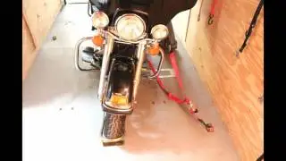 How to transport a motorcycle with straps and a wheel chock