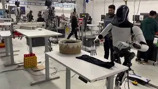 Tesla Bot Optimus is folding laundry!