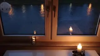Rainy December Evening. Rain on Window.