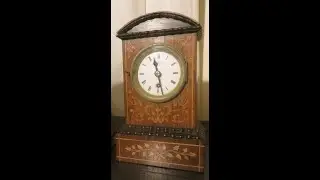 Austrian clock with inlaid case and verge escapement.