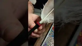 Beading onto a feather