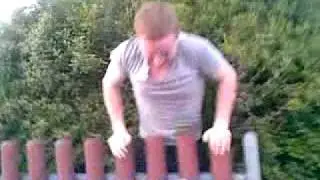 Craig Yeomans in a bush trying to get his ball..