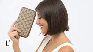 A Beautiful Gucci round zip fabric leather wallet for women.