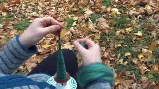 Spinning on a support spindle. Seaweed greens and autumn leaves (including slow motion)
