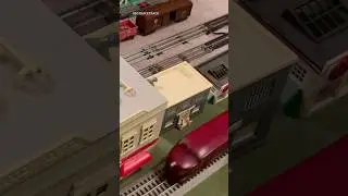 Lionel 2056 pulling 4 passenger cars meet a Weaver Hi-rail ALCo FA