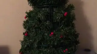 Santa&rsquo;s Secret Tree Animated Musical Lighted Santa And The Santastics
