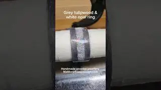 Super satisfying applying finish to a grey tulipwood and white opal ring