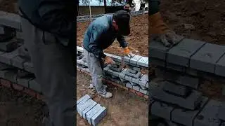 Brick fence making with skilled construction worker