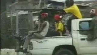 Liberian militiamen operating a DShKM before being shot at themselves