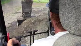 This is how I load trucks from ground level with a hoe