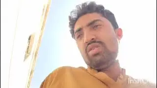 He is sitting in tha sun at his home
