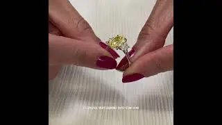 3.01 carat Fancy Intense Yellow Oval Diamond Three-Stone Ring