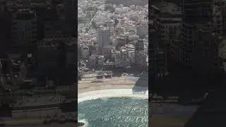 Air Force One flies over sign thanking President Trump on the beach of Tel Aviv, Israel