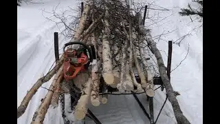 Snow mobile Logging with help from  Husqvarna 550 Yamaha Viking for next years fire wood